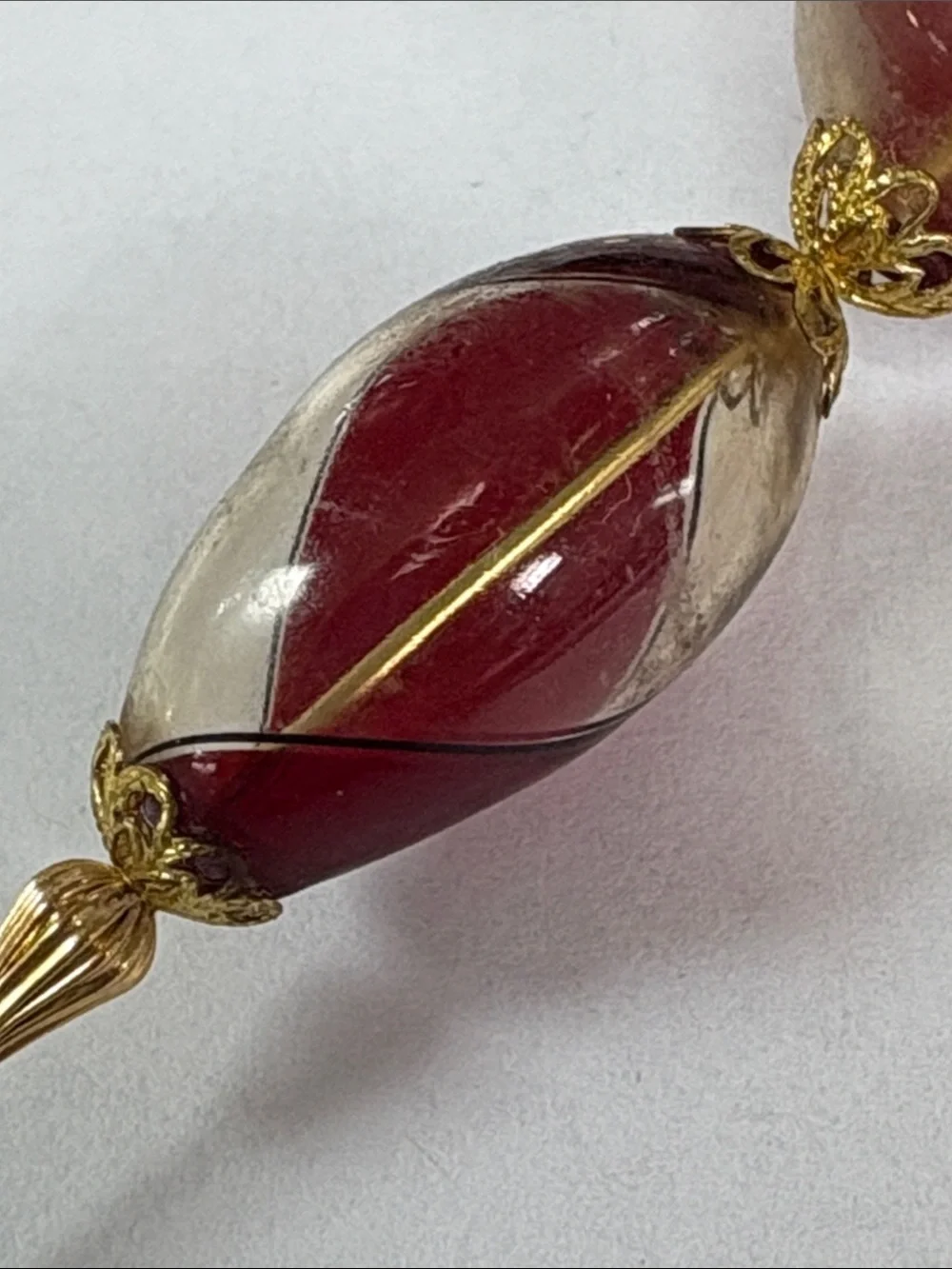 Gold-Tone Stick Brooch with Red and Cream Glass Beads
